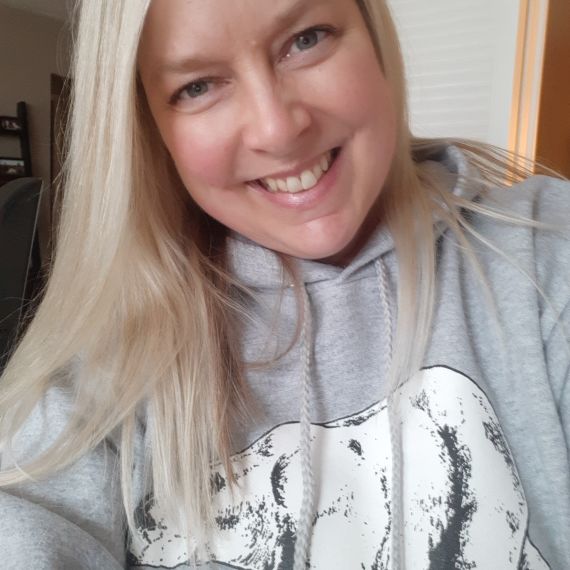 Selfie of Lenore N. wearing a polar bear hoodie